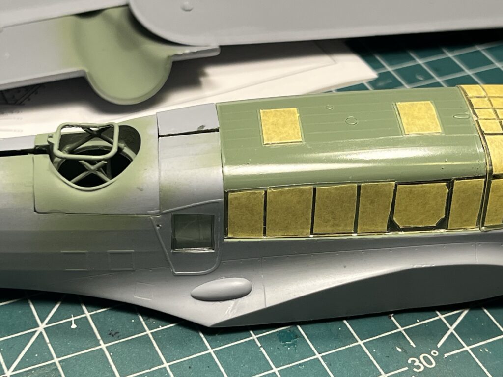 Glazing and panels masked before painting