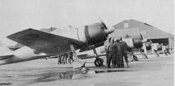 A Mitsubishi A6M3 Model 32 Zero on an airfield